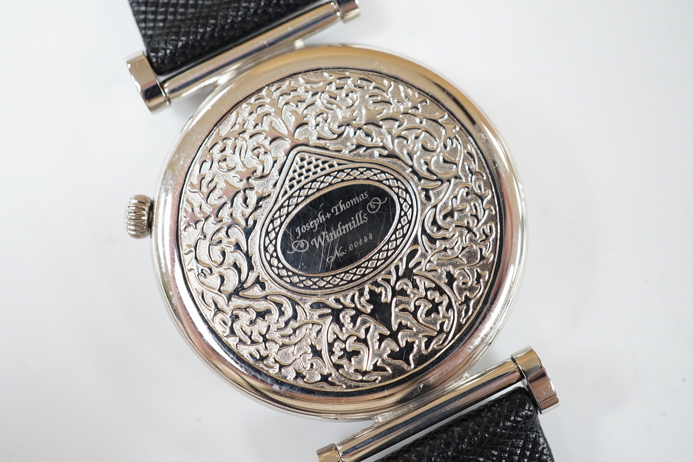 A gentleman's 2006 Joseph & Thomas Windmills Bartholomew First Edition white metal (stamped 950 for platinum) manual wind wrist watch, numbered 00144/00150, on leather strap with stainless steel deployment clasp, with or